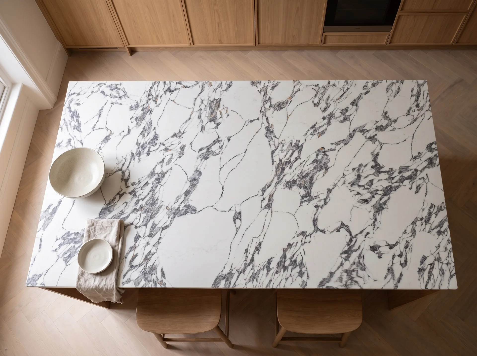 Arabescato Gold V2 quartz worktop shown from an overhead kitchen view