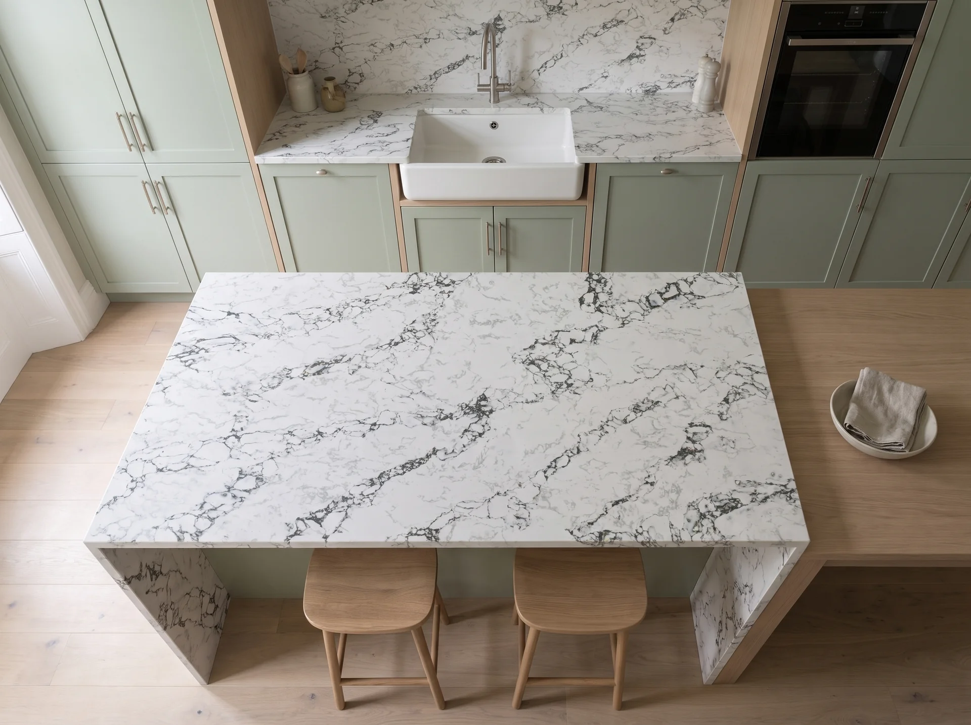 Arabescato Green quartz worktop shown from an overhead kitchen view
