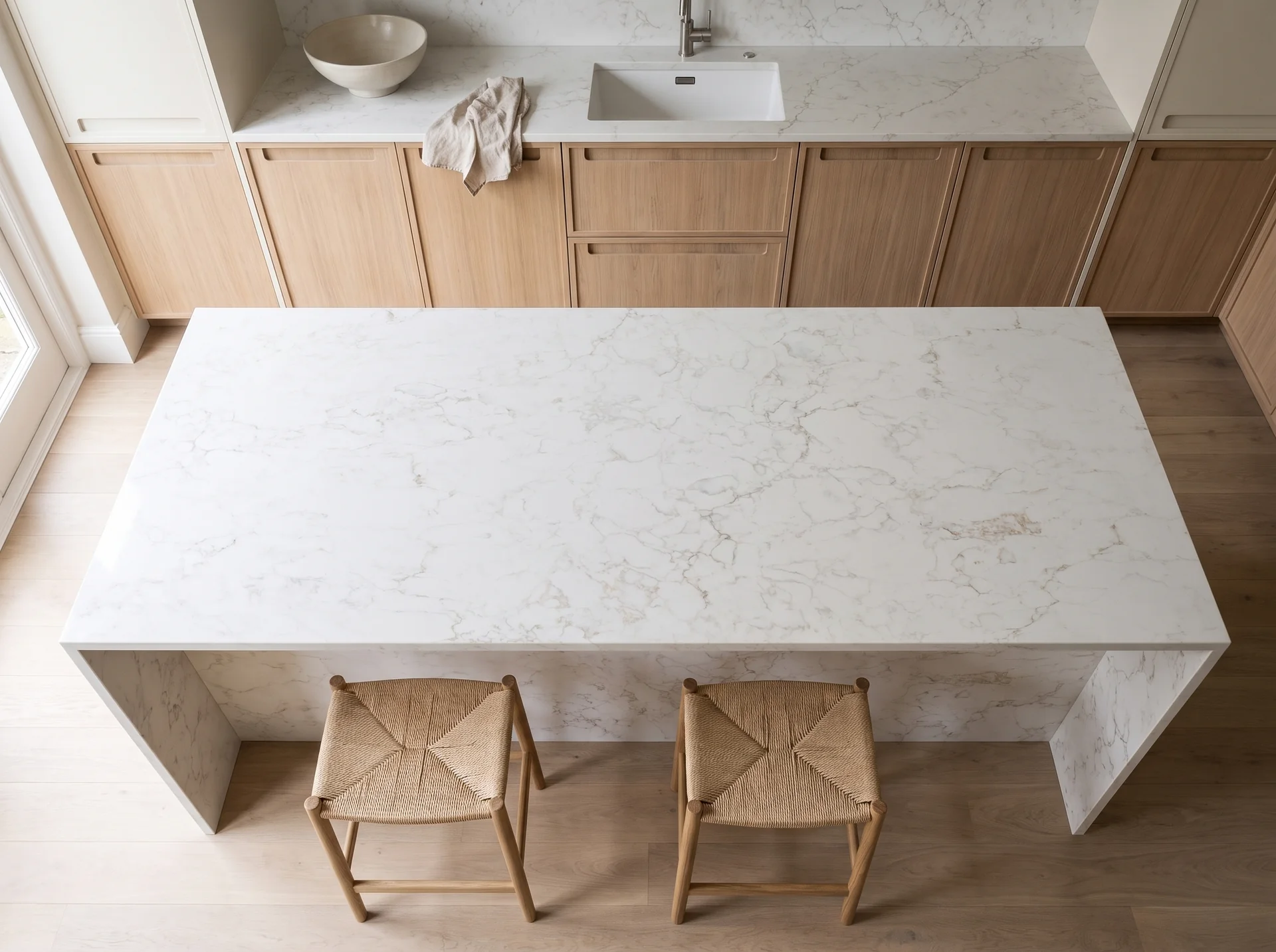 Arabescato Lite quartz worktop shown from an overhead kitchen view