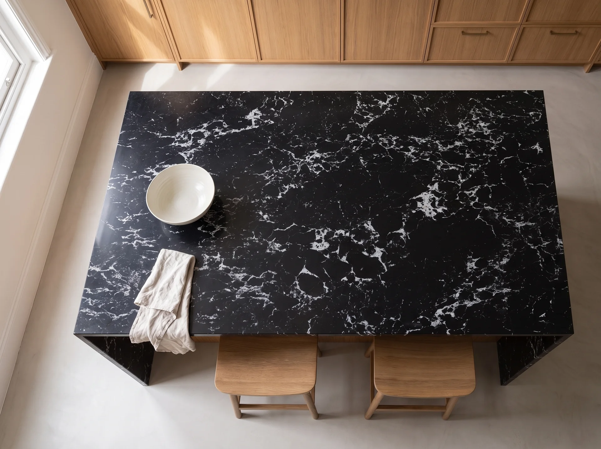 Arabescato Noiro quartz worktop shown from an overhead kitchen view