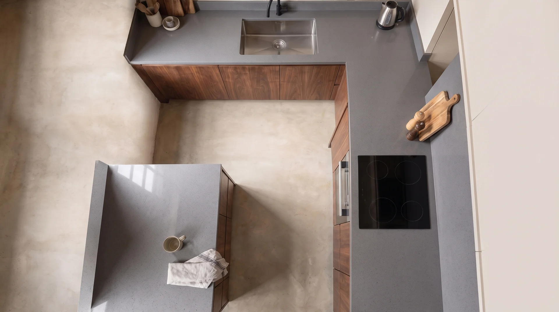 Stellar Light Gris quartz worktop shown from an overhead kitchen view