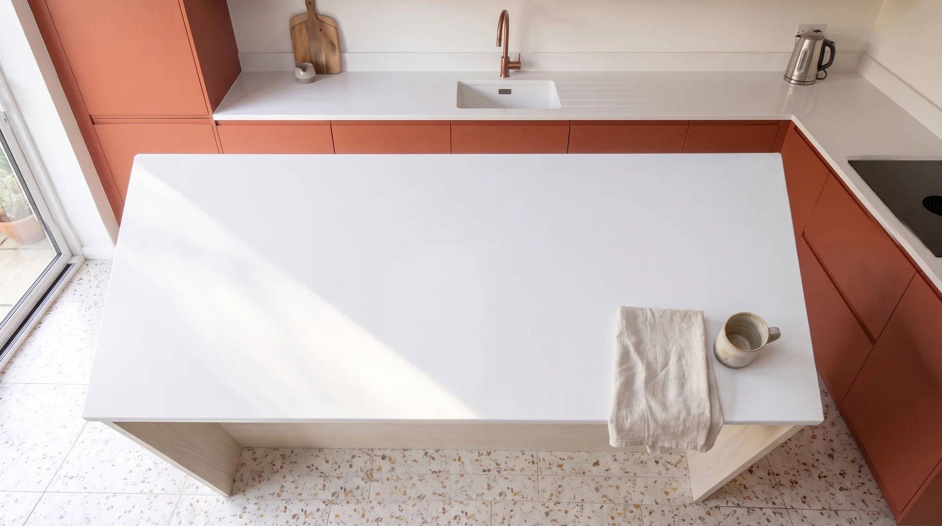 Pure White quartz worktop shown from an overhead kitchen view