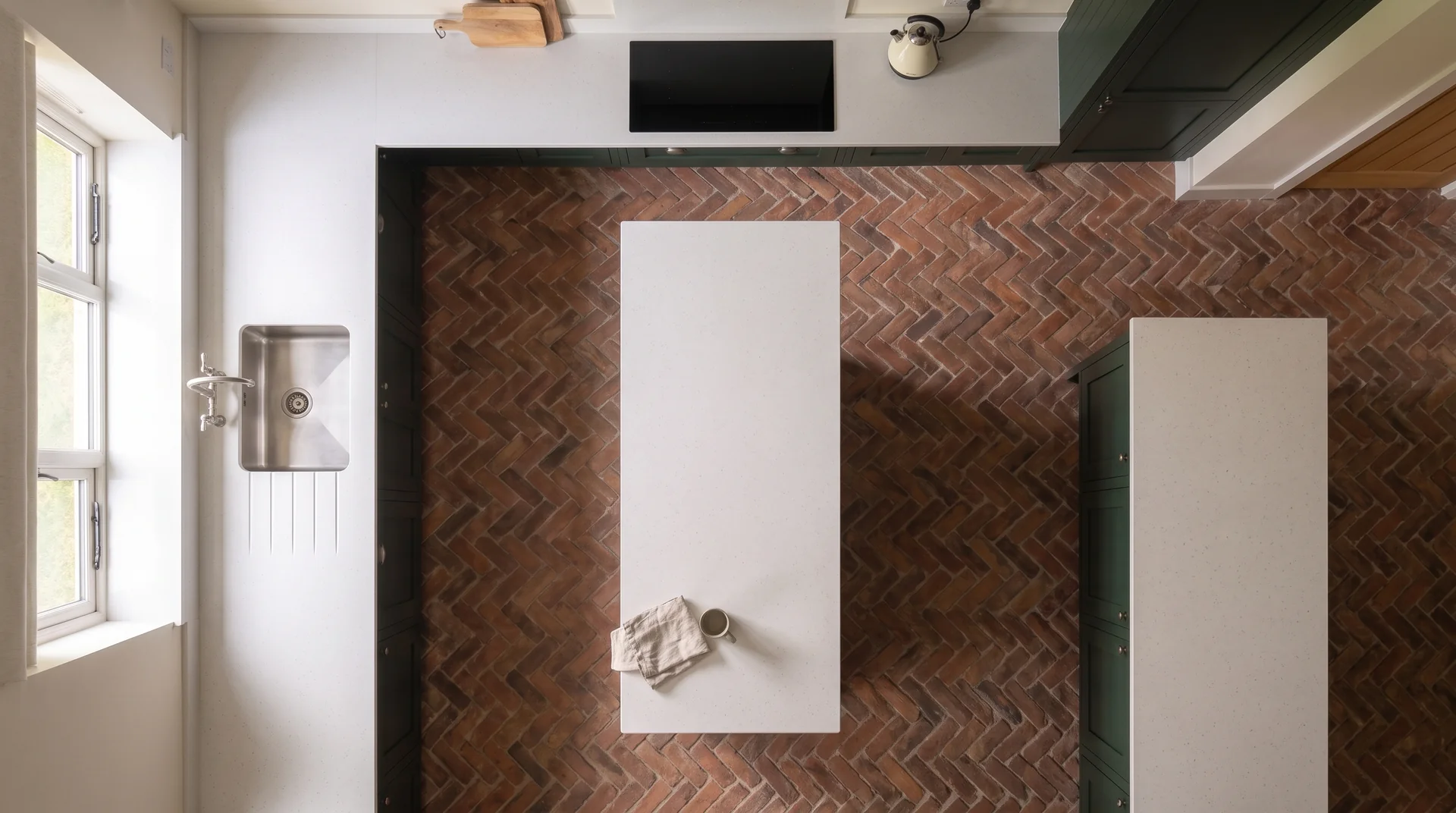 Snow White quartz worktop shown from an overhead kitchen view