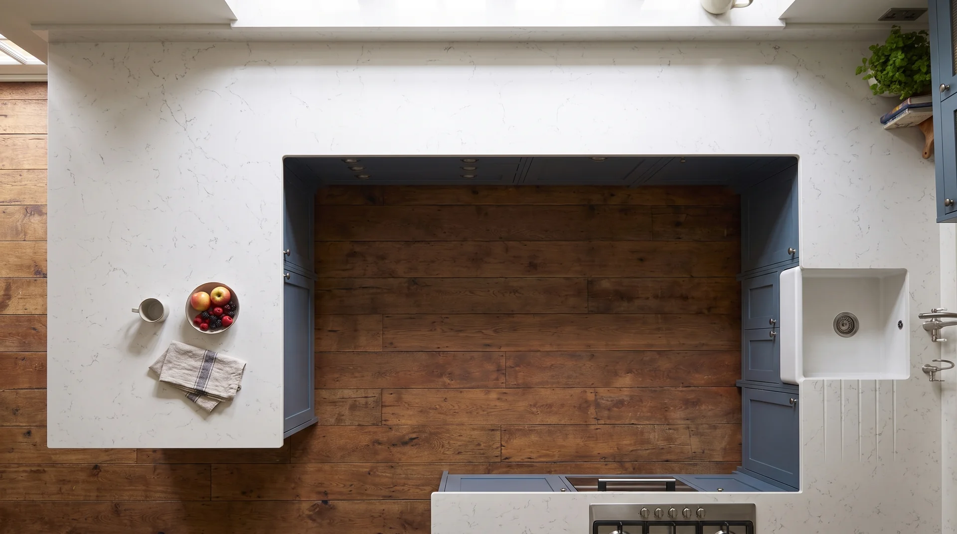 Carrara Light quartz worktop shown from an overhead kitchen view