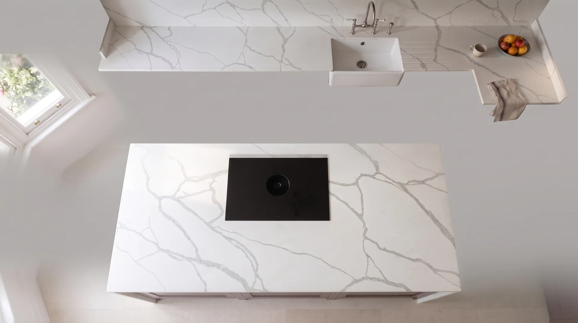 Statuario Bromio quartz worktop shown from an overhead kitchen view