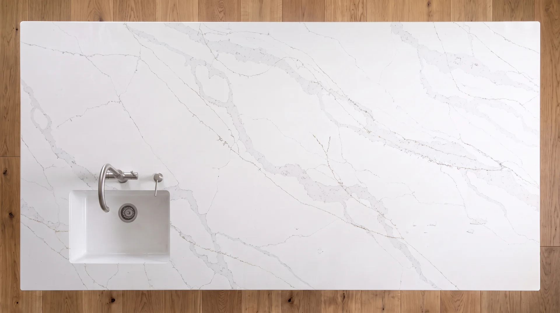 Calacatta Light quartz worktop shown from an overhead kitchen view