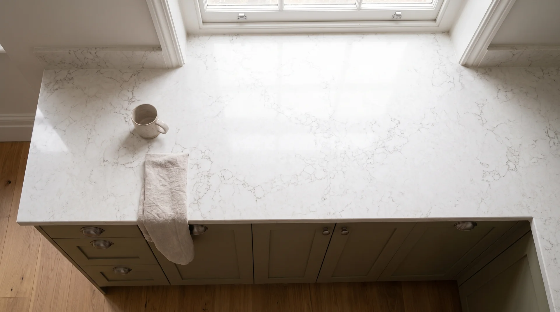 Statuario Gold quartz worktop shown from an overhead kitchen view