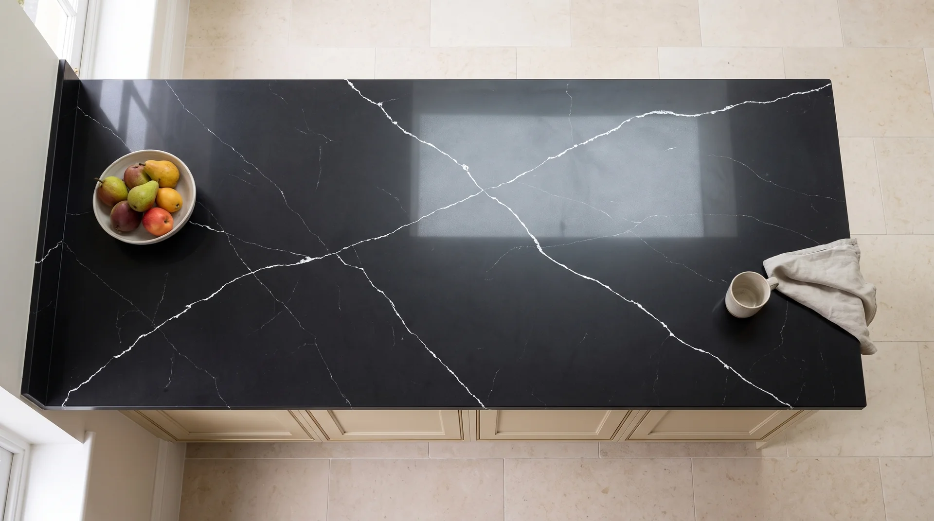Black Marquina quartz worktop shown from an overhead kitchen view