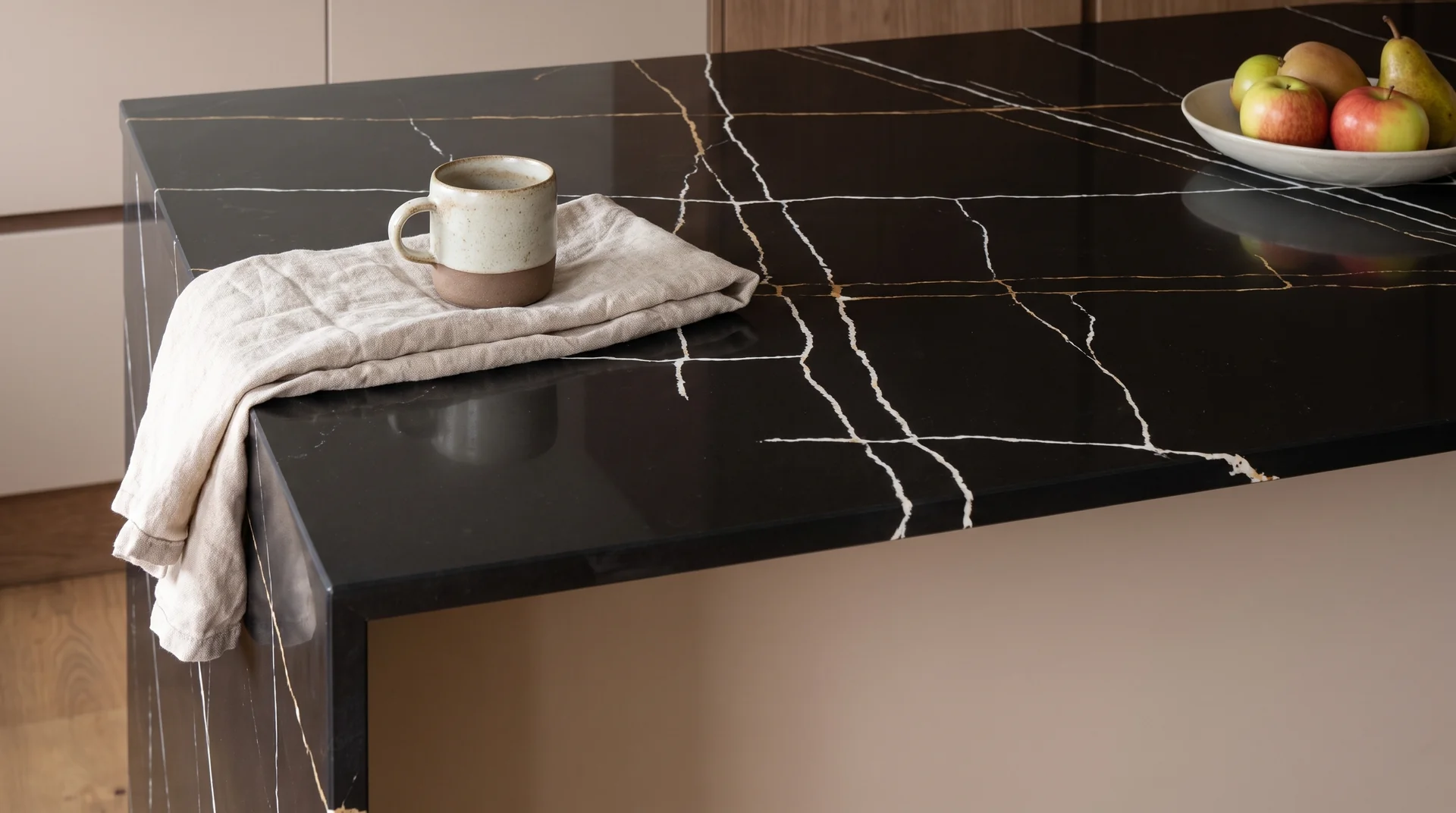 Sahara Noir quartz worktop close-up showing surface detail