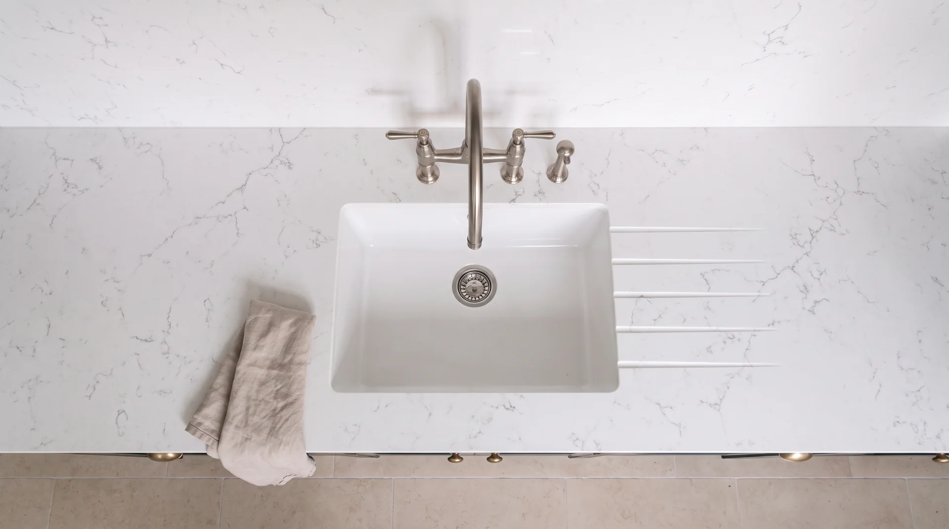 Carrara Onyx quartz worktop shown from an overhead kitchen view
