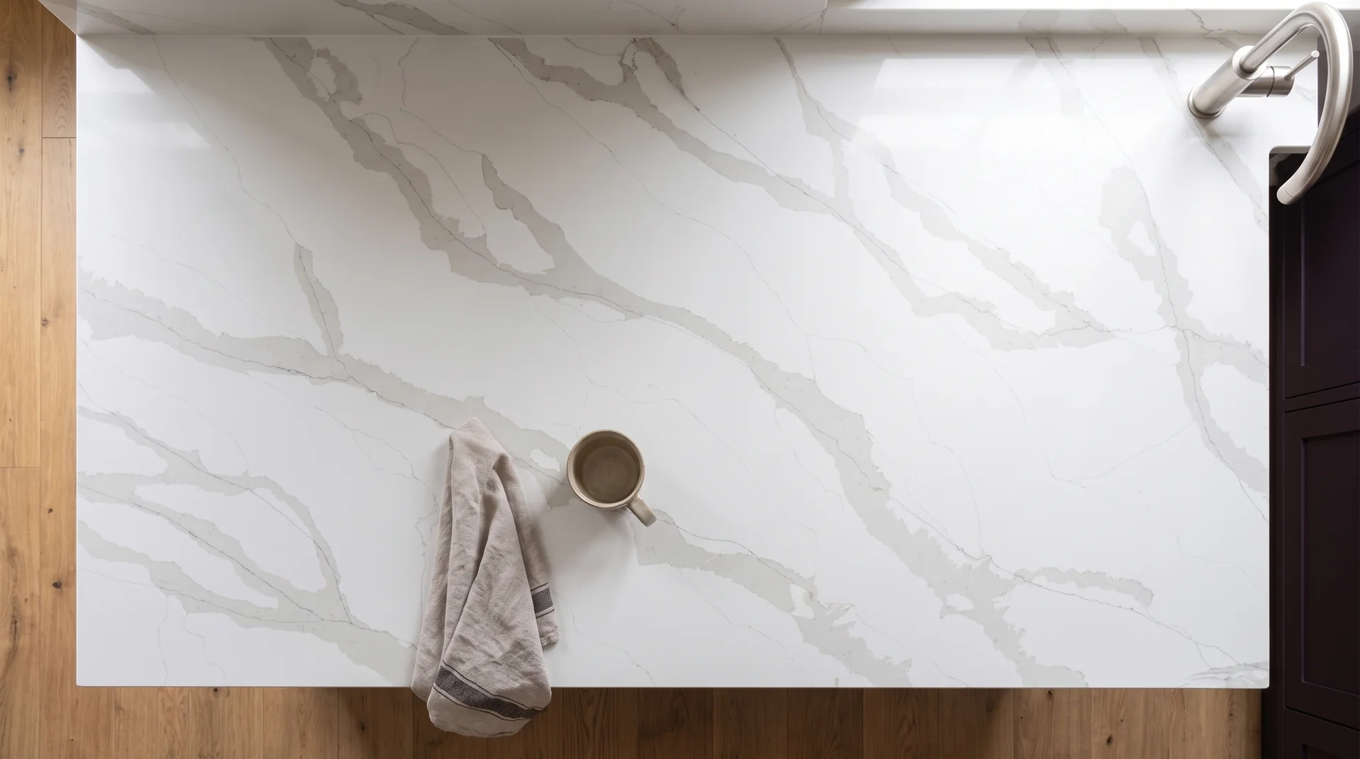 Calacatta Gold Extra quartz worktop shown from an overhead kitchen view