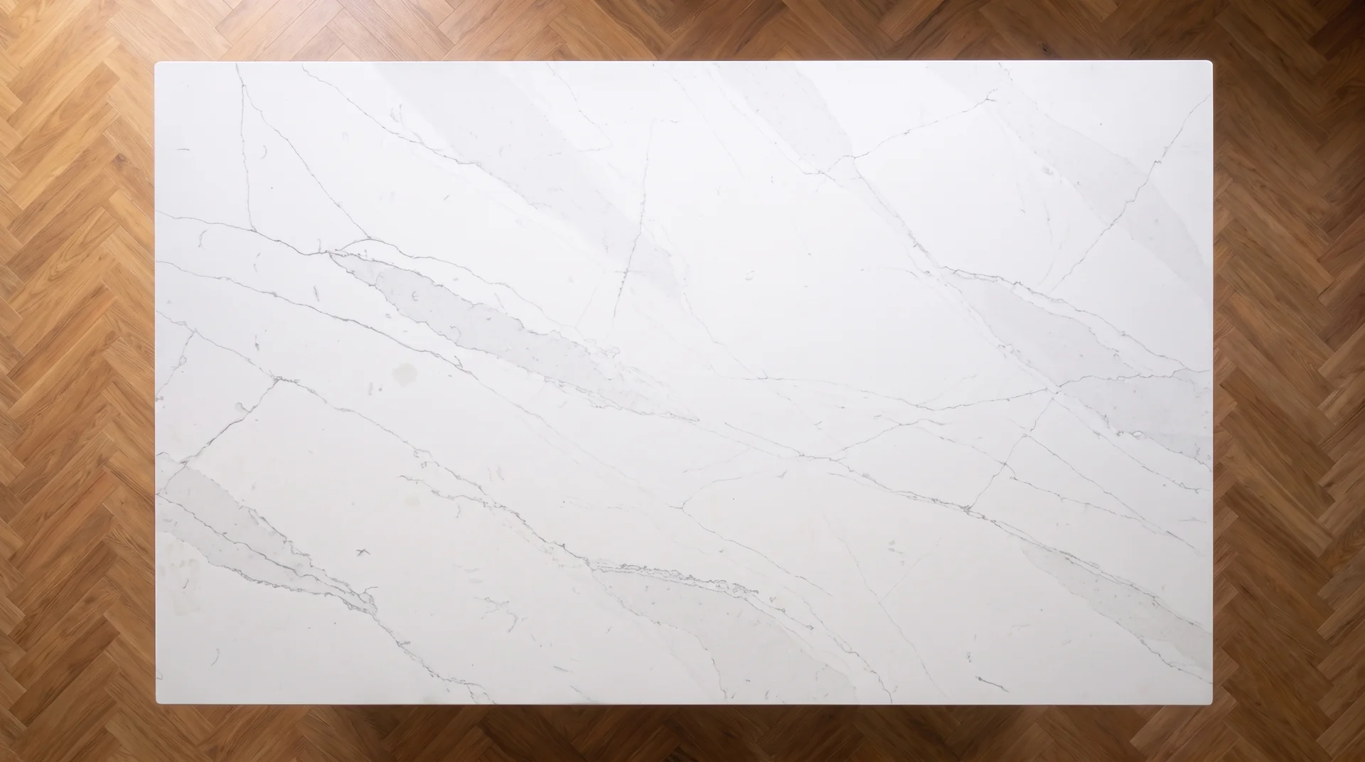 Statuario Royal quartz worktop shown from an overhead kitchen view