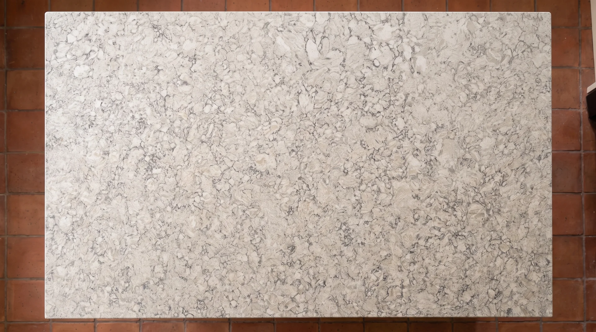 Ice Canyon quartz worktop shown from an overhead kitchen view