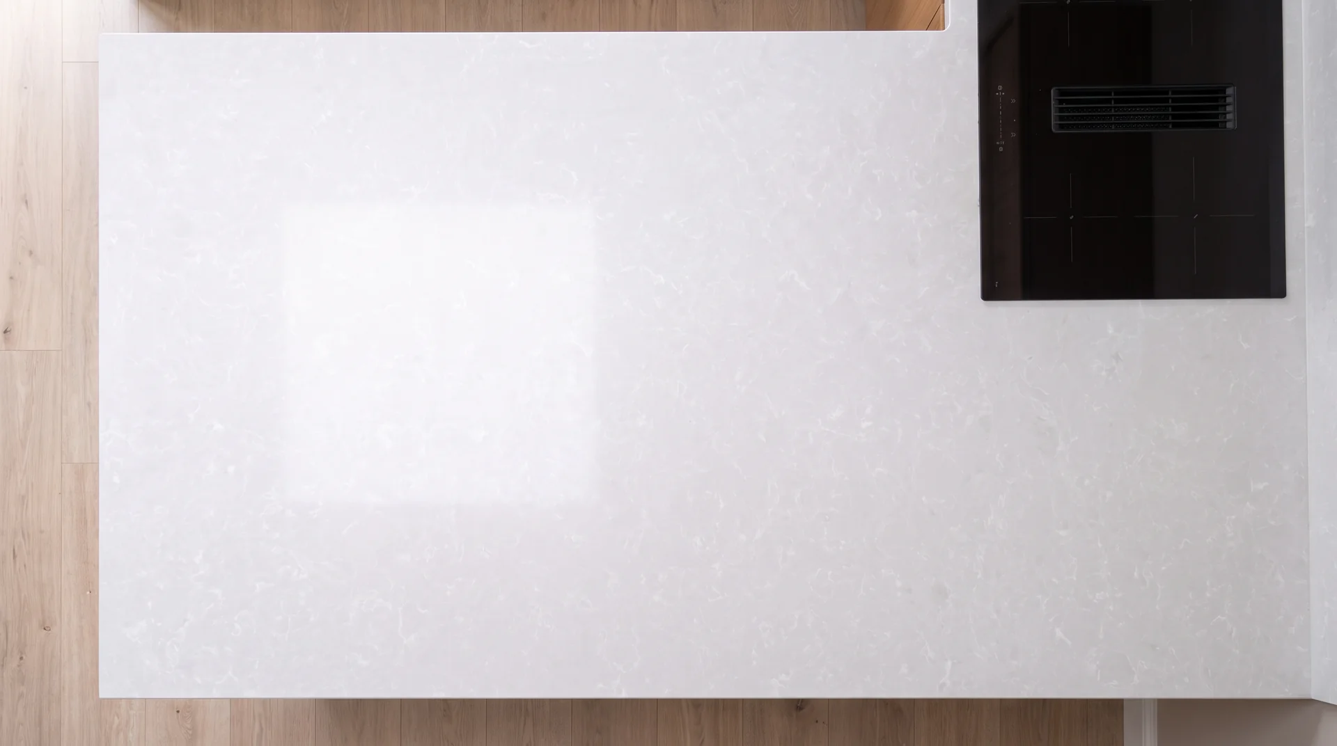 White Onyx quartz worktop shown from an overhead kitchen view
