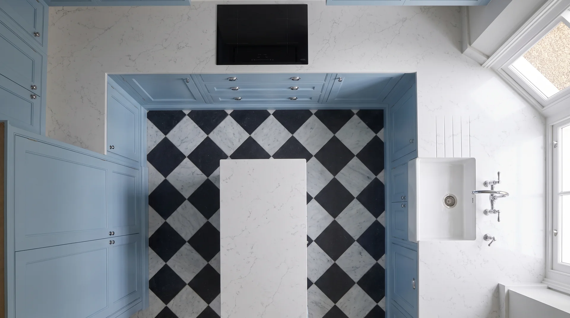 Alaska White quartz worktop shown from an overhead kitchen view