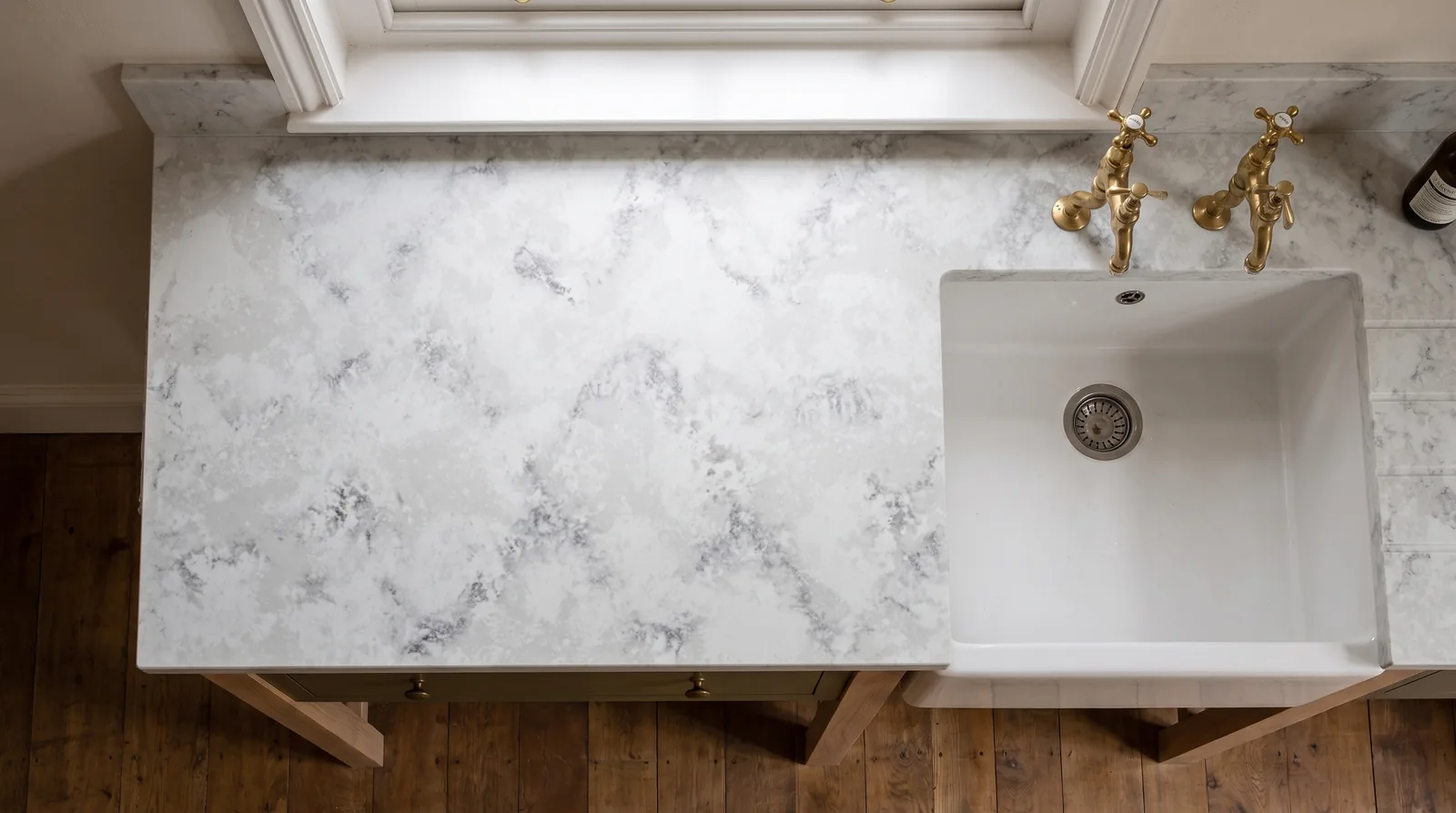 Luna Bianco Leather NobleStone worktop in an overhead kitchen view