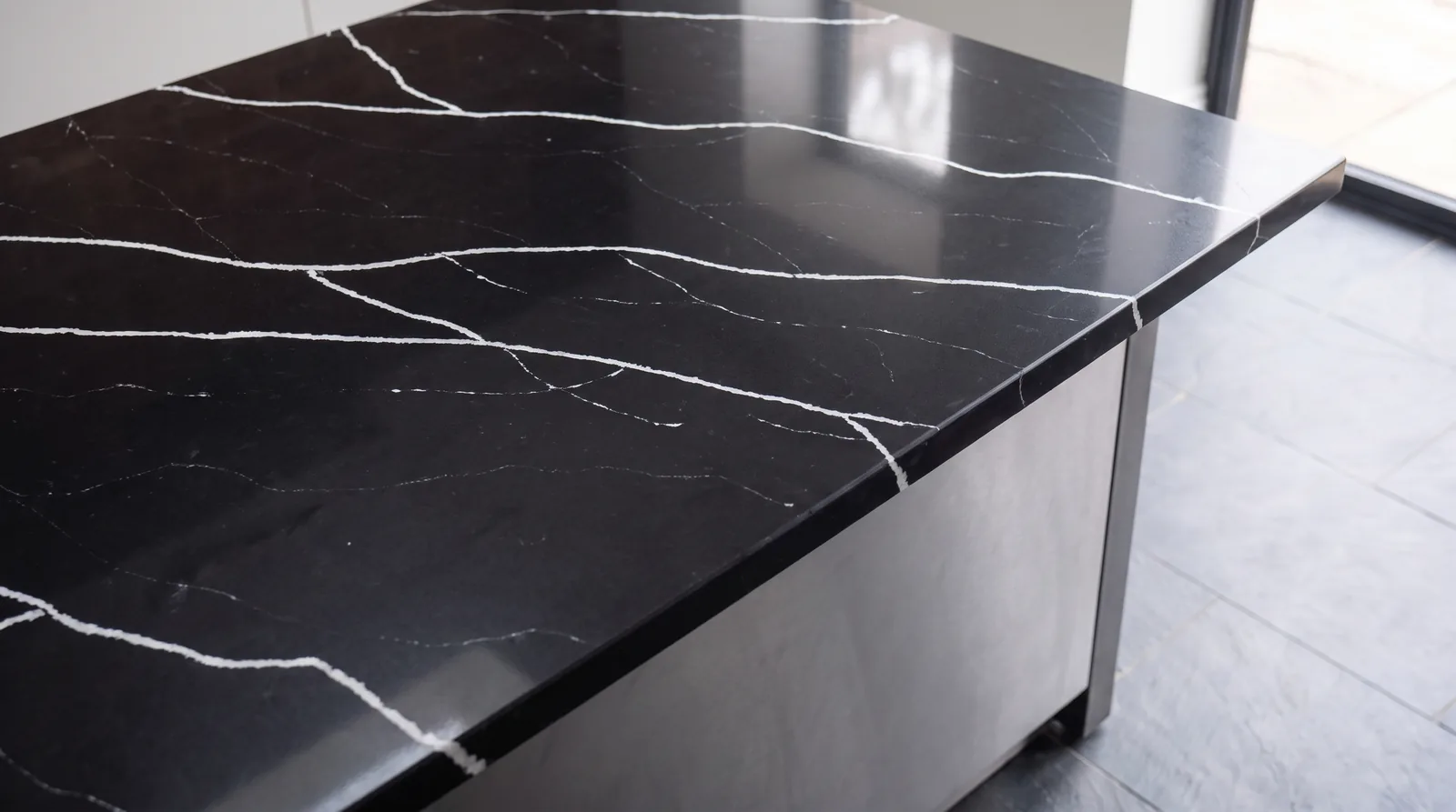 Marquina NobleStone worktop in a close kitchen detail view