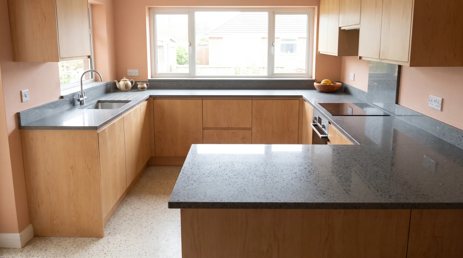 Mirror Grey NobleStone worktop in a wide kitchen view