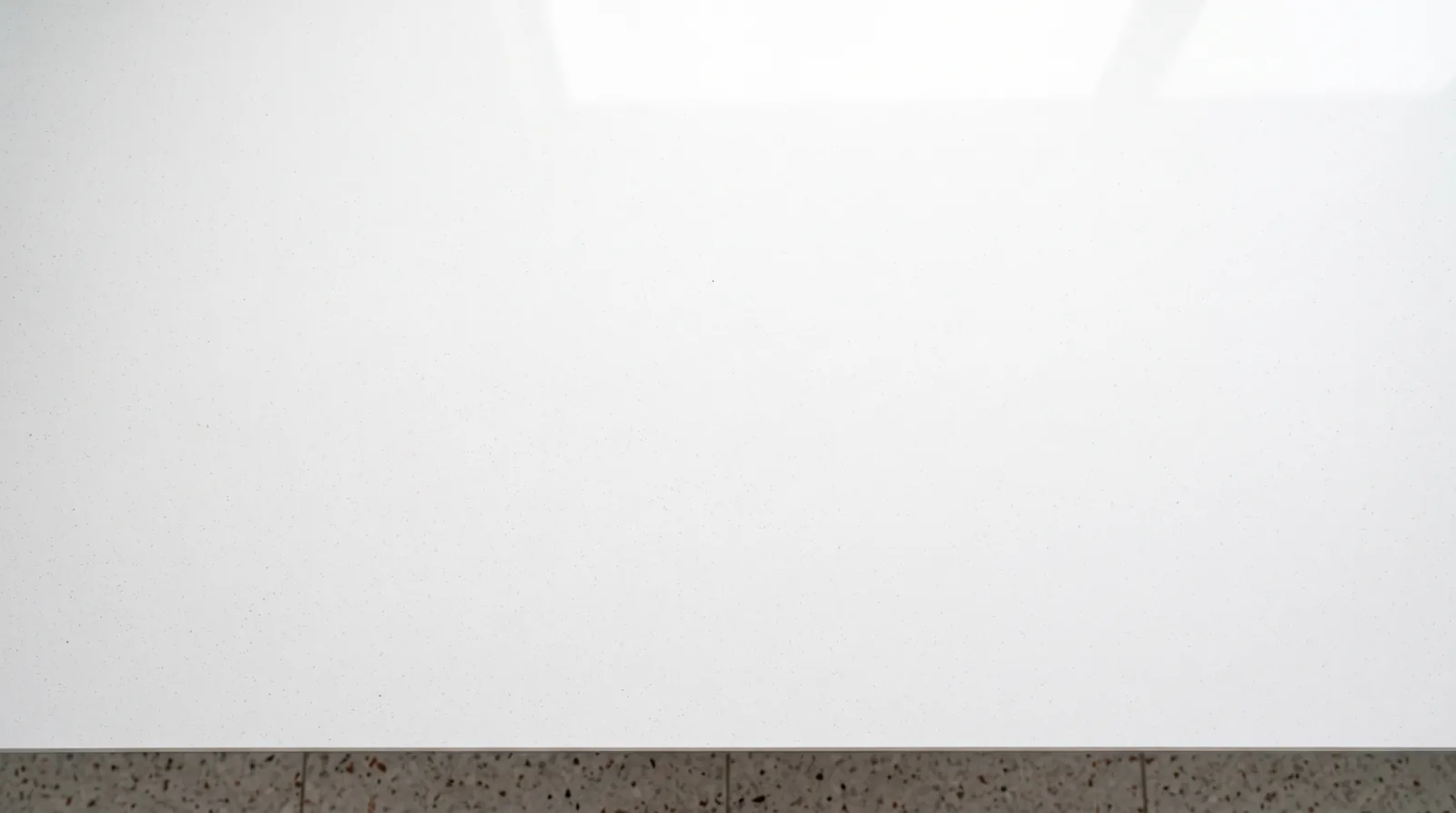 Super White NobleStone worktop in an overhead kitchen view
