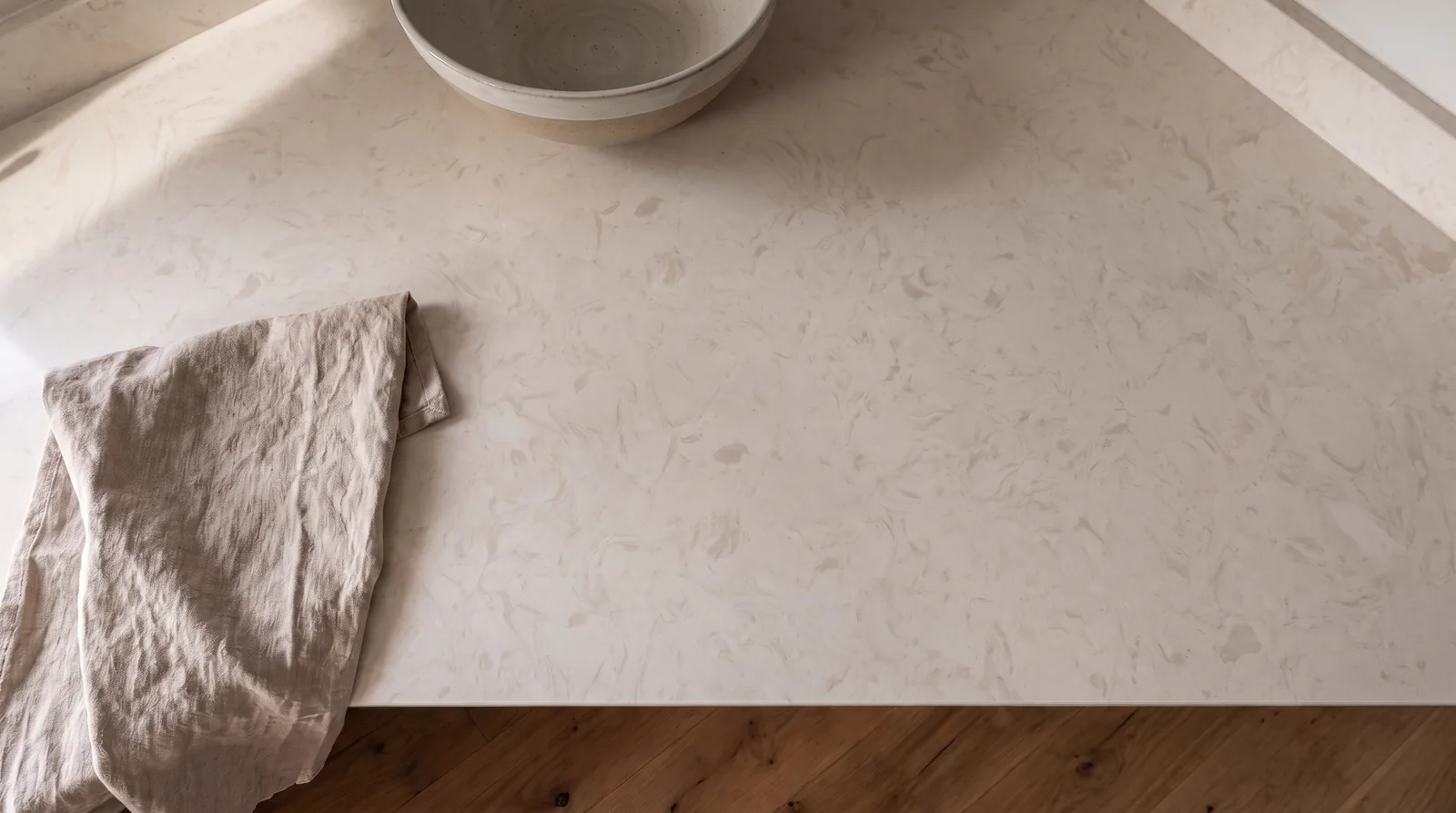 Vanilla NobleStone worktop in an overhead kitchen view
