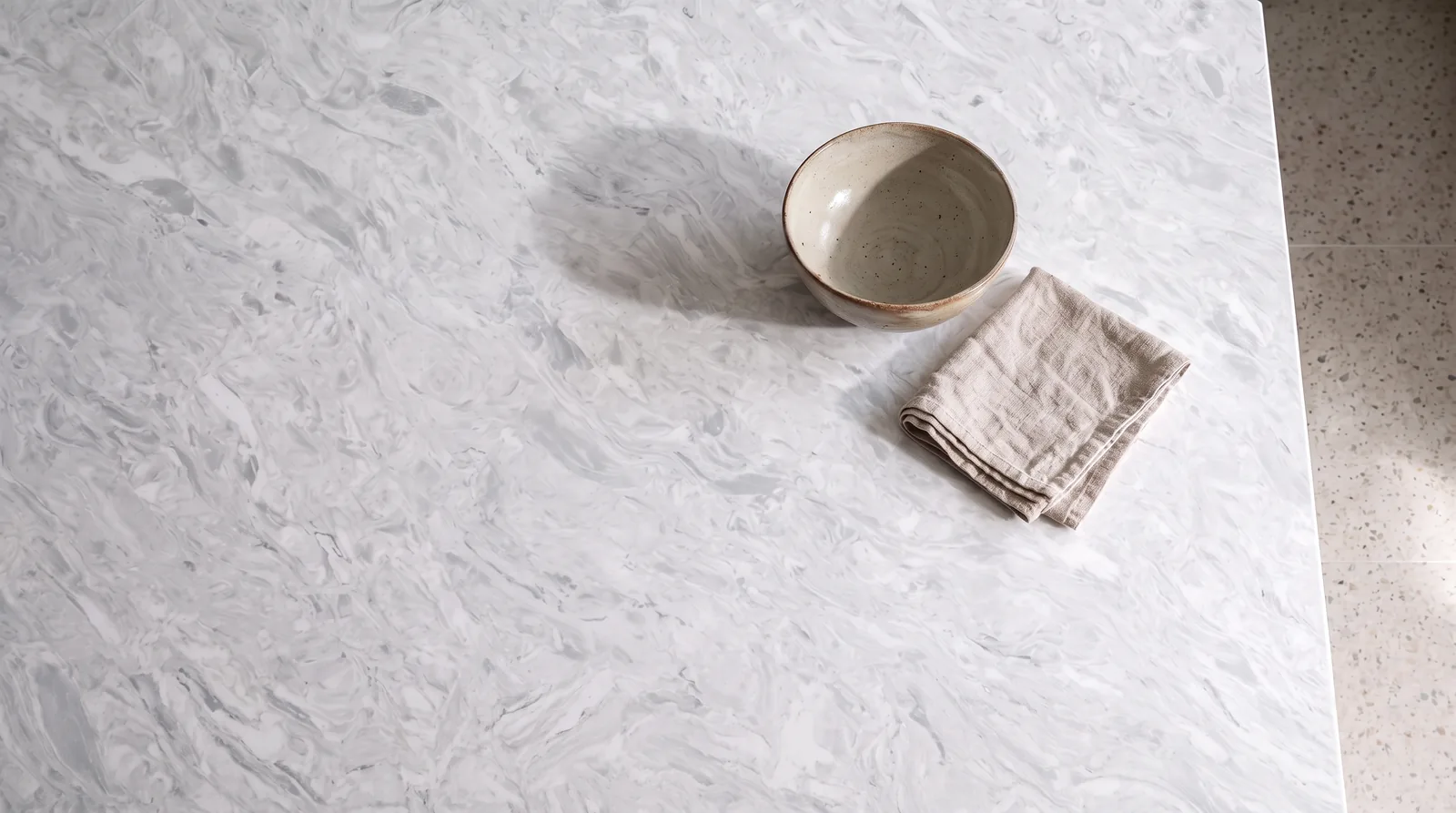 White Fusion NobleStone worktop in an overhead kitchen view