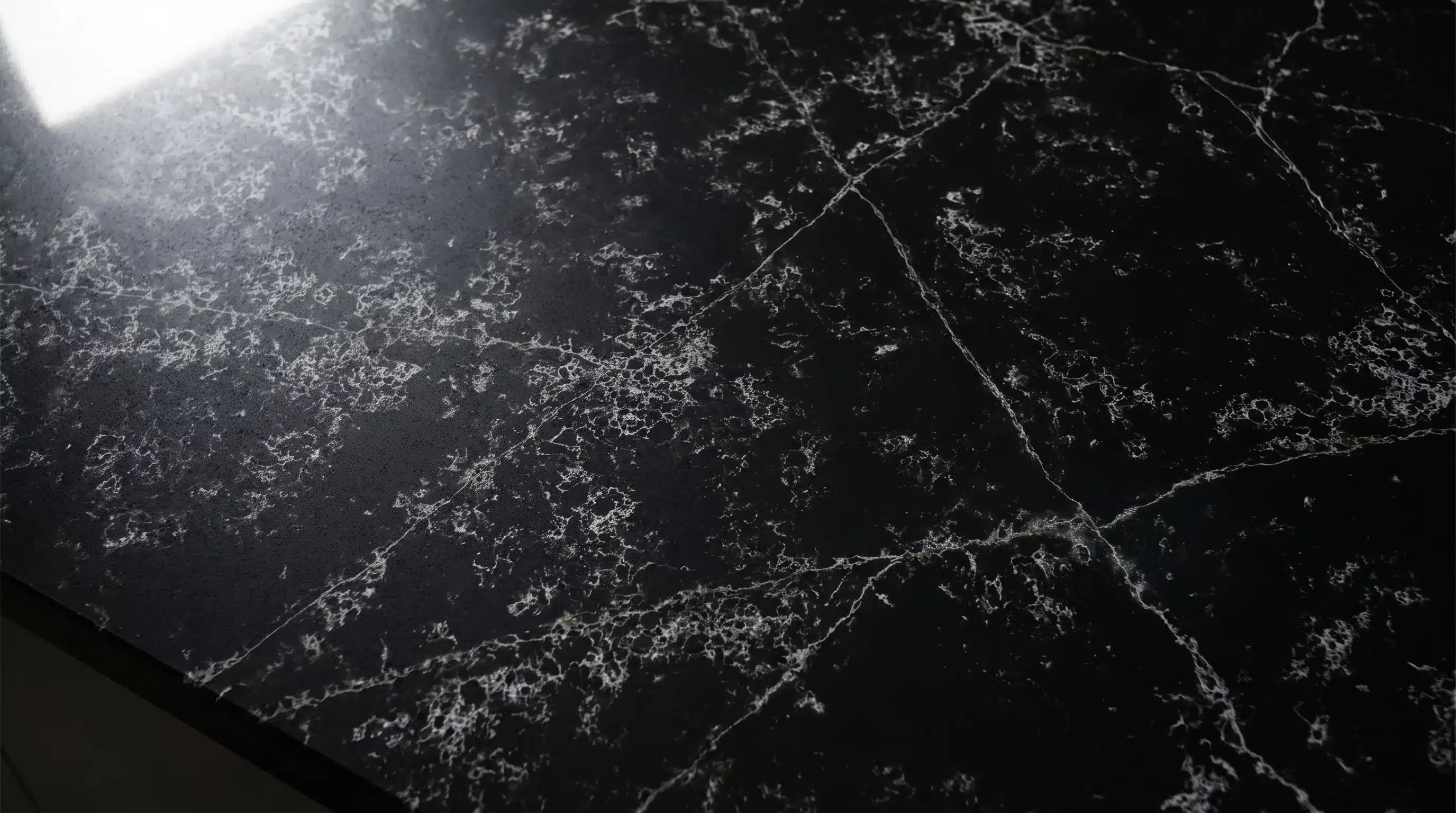 Close-up of Roma Black CQM321 quartz worktop surface detail