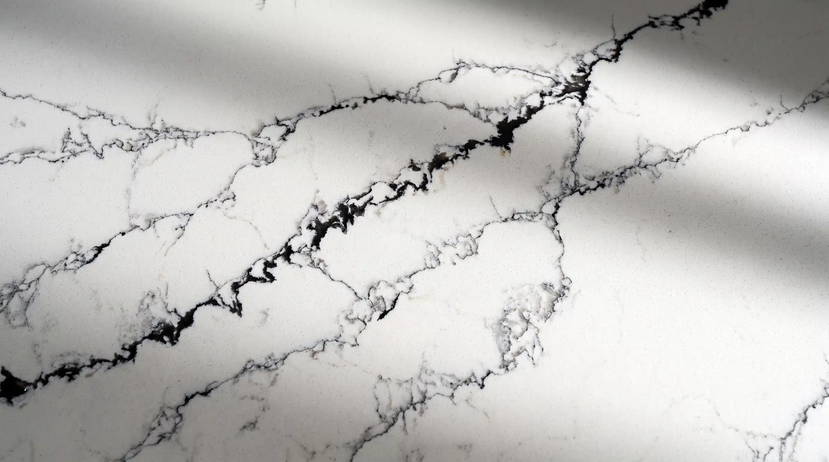 Close-up of Calacatta Noir CQM466 quartz worktop surface detail